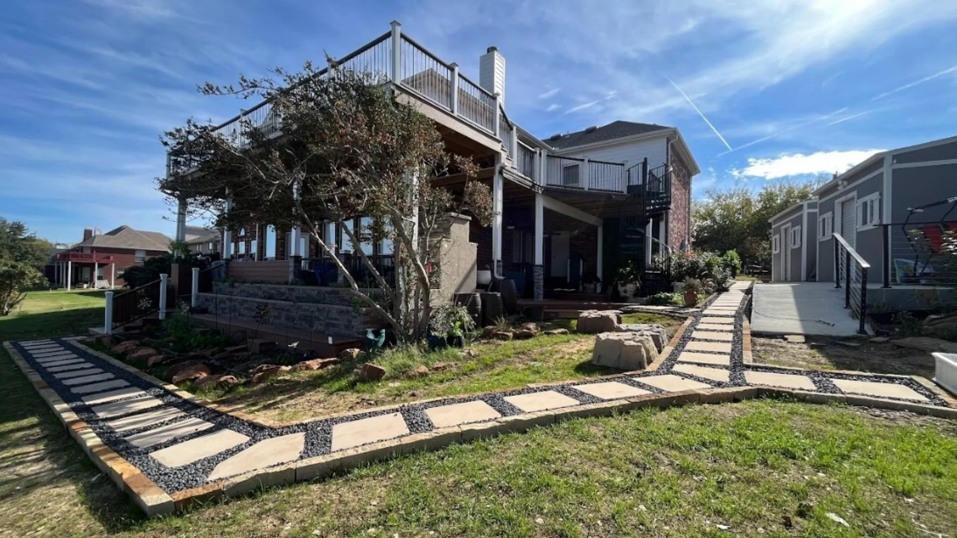 Front lawn in Lewisville, TX with shrubs.