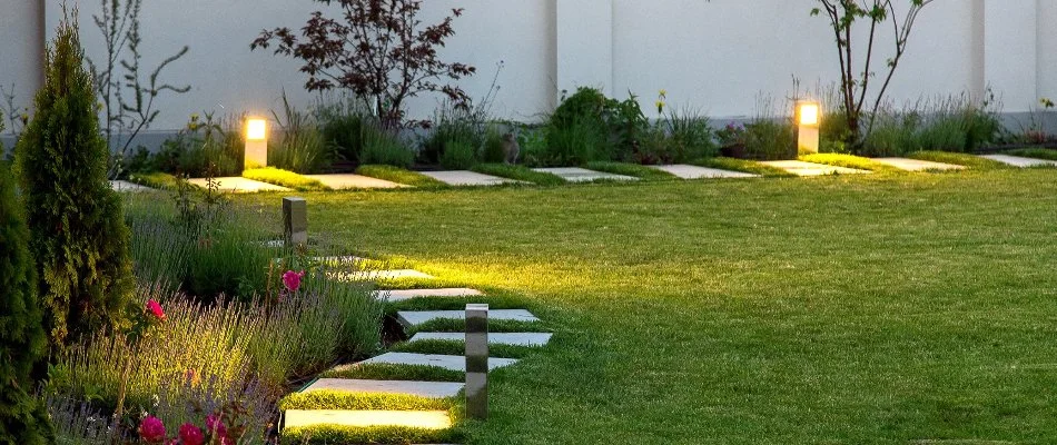 Outdoor lighting along landscape beds in Highland Village, TX.