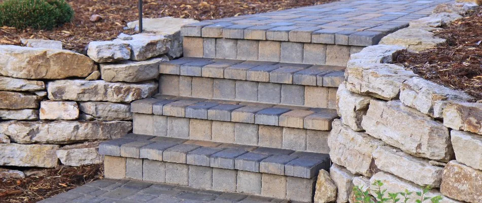 Outdoor steps in Flower Mound, TX, between retaining walls.